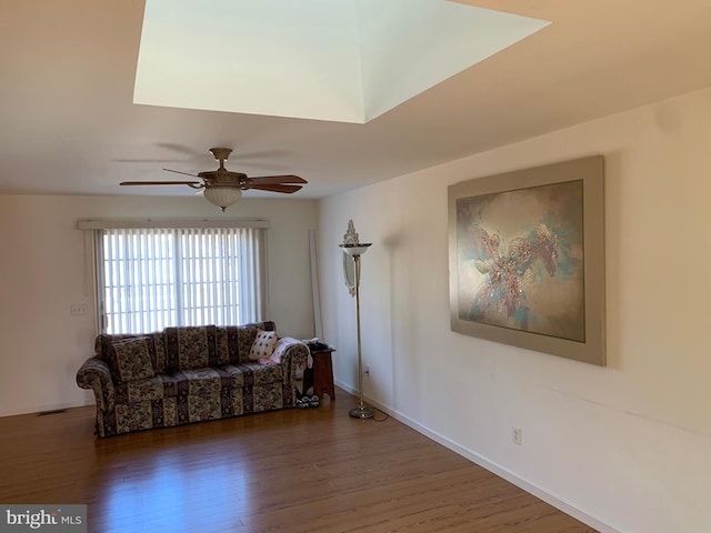 unfurnished living room with ceiling fan and dark hardwood / wood-style flooring