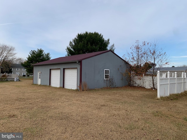 garage featuring a lawn