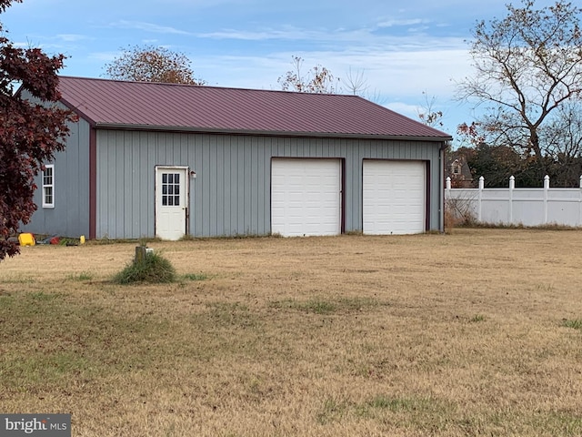 garage with a yard