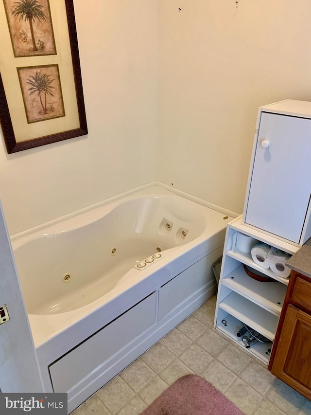 bathroom featuring a washtub and tile patterned floors