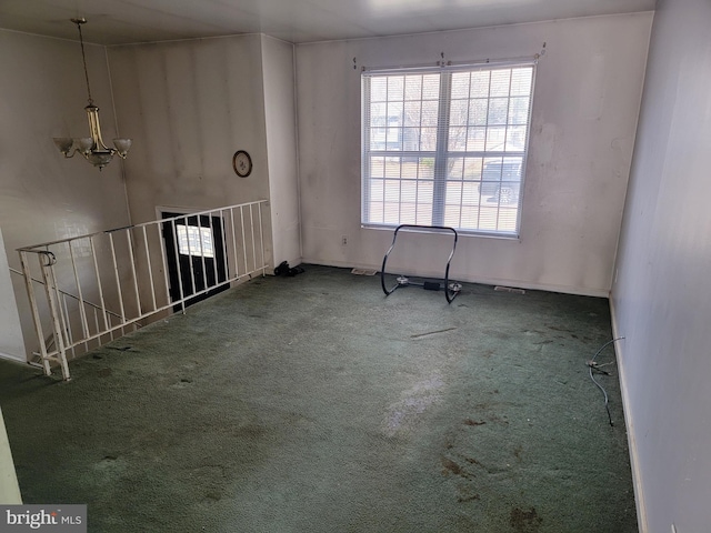 2024 Yew Ct, Saint Leonard, MD 20685 - spare room featuring carpet floors, a chandelier, and baseboards