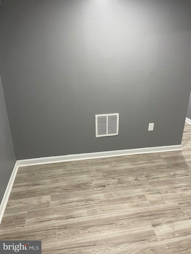 unfurnished room featuring light wood-type flooring