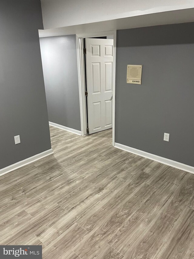 unfurnished room with light hardwood / wood-style flooring