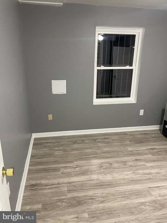 spare room featuring light hardwood / wood-style flooring