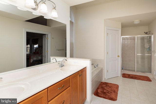 bathroom with separate shower and tub, tile patterned flooring, and vanity