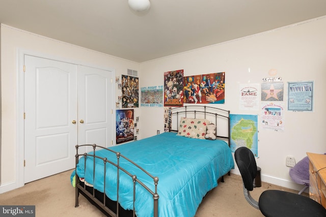 carpeted bedroom featuring a closet