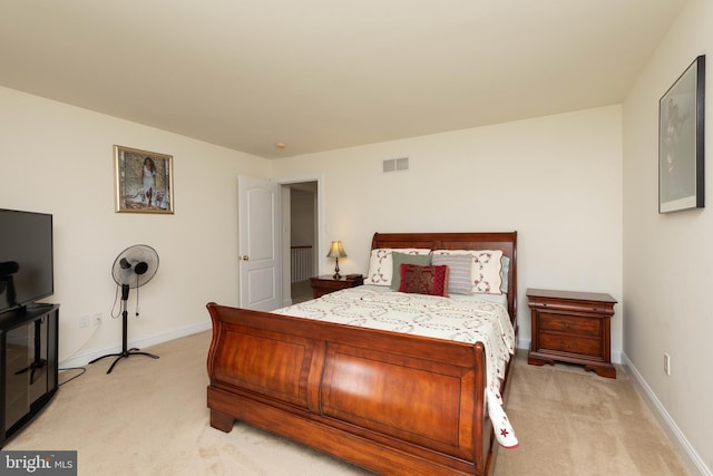 bedroom featuring light colored carpet