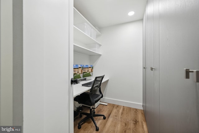 office space with light wood-type flooring