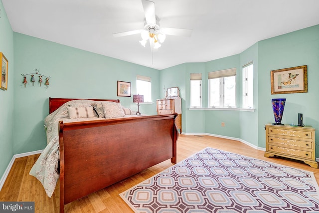 bedroom featuring ceiling fan and light hardwood / wood-style flooring