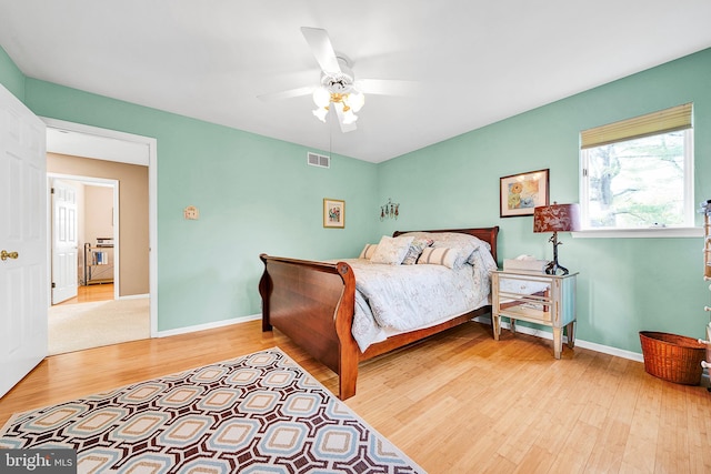 bedroom with wood-type flooring and ceiling fan