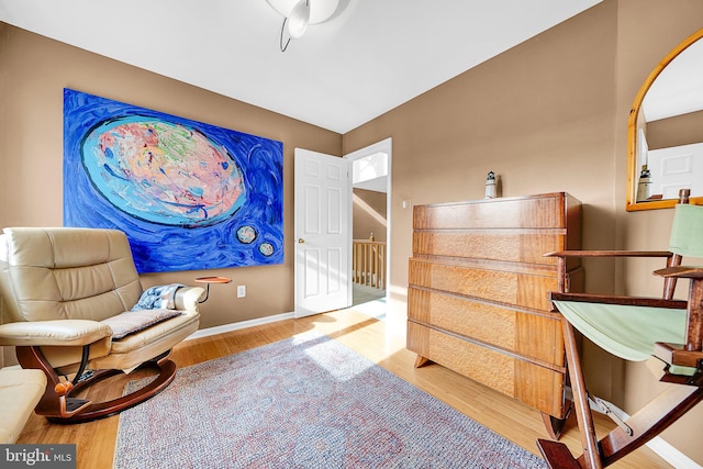 sitting room with hardwood / wood-style floors