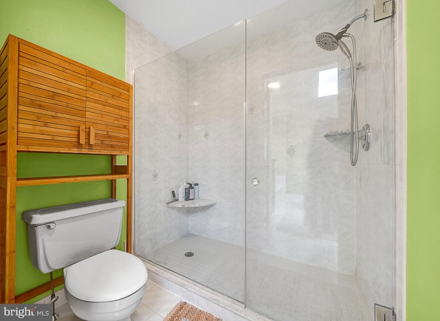 bathroom with toilet, tile patterned flooring, and walk in shower