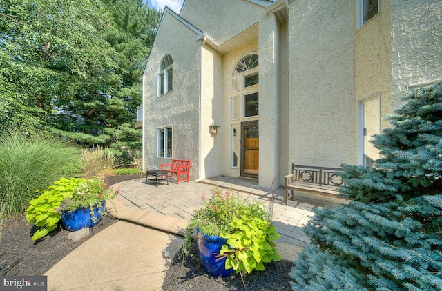 doorway to property featuring a patio area