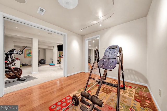 workout area featuring hardwood / wood-style floors