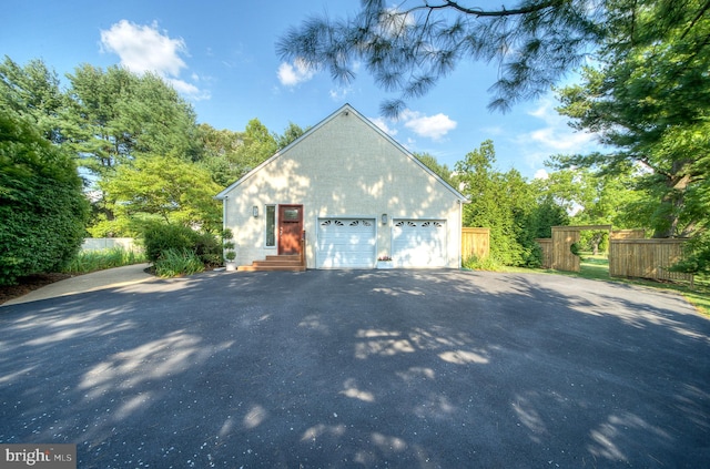 view of side of property featuring a garage