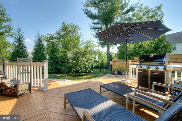 wooden deck with area for grilling