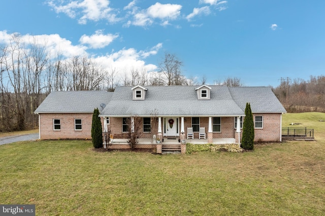 310 Updyke Rd, Littlestown, PA 17340 - rear view of house featuring a yard, brick siding, and a porch