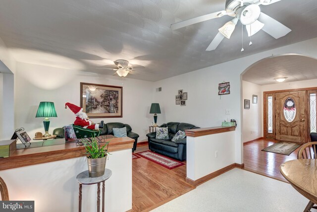 310 Updyke Rd, Littlestown, PA 17340 - living area with a ceiling fan, arched walkways, and baseboards