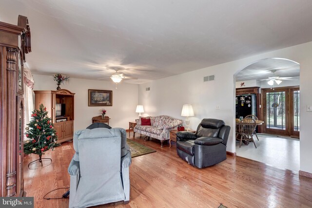 310 Updyke Rd, Littlestown, PA 17340 - living area featuring a ceiling fan, arched walkways, and light wood-style floors