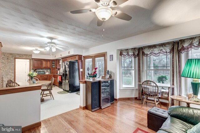 310 Updyke Rd, Littlestown, PA 17340 - living area with beverage cooler, ceiling fan, light wood-type flooring, and baseboards