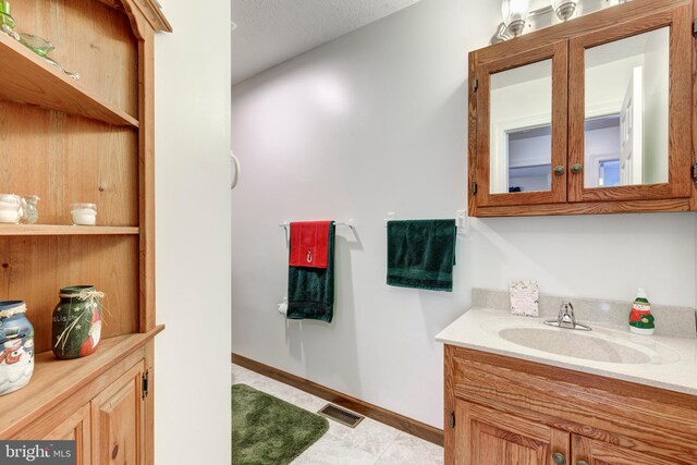 310 Updyke Rd, Littlestown, PA 17340 - bathroom with vanity, baseboards, and tile patterned floors