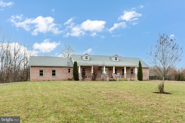 310 Updyke Rd, Littlestown, PA 17340 - view of front of home featuring covered porch, a front lawn, and brick siding