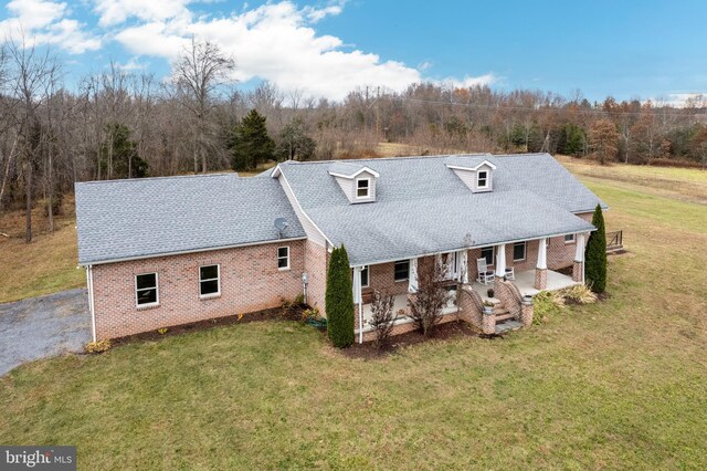 310 Updyke Rd, Littlestown, PA 17340 - rear view of property with brick siding, a lawn, a patio, and roof with shingles