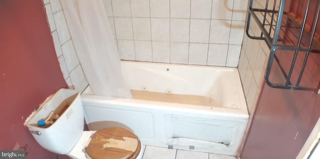 bathroom featuring tile patterned floors and toilet