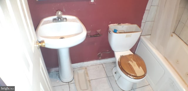 bathroom featuring tile patterned flooring and toilet