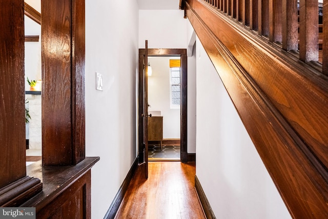 corridor with wood-type flooring