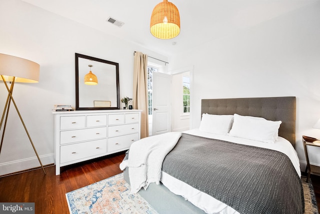 bedroom featuring dark hardwood / wood-style flooring