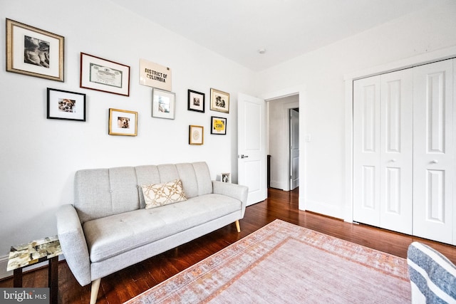 living room with dark hardwood / wood-style flooring