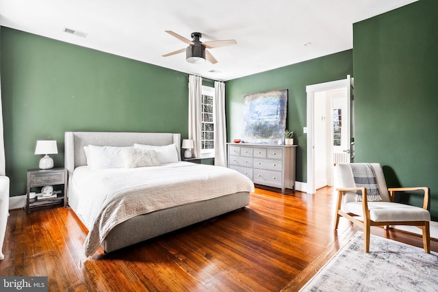 bedroom featuring hardwood / wood-style flooring and ceiling fan