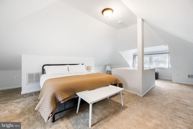 carpeted bedroom featuring lofted ceiling