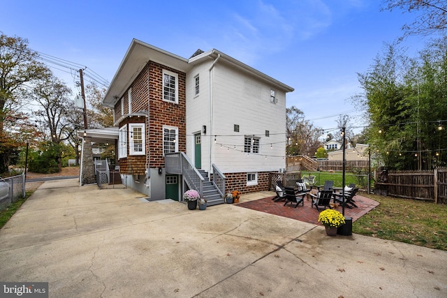 rear view of property with a patio