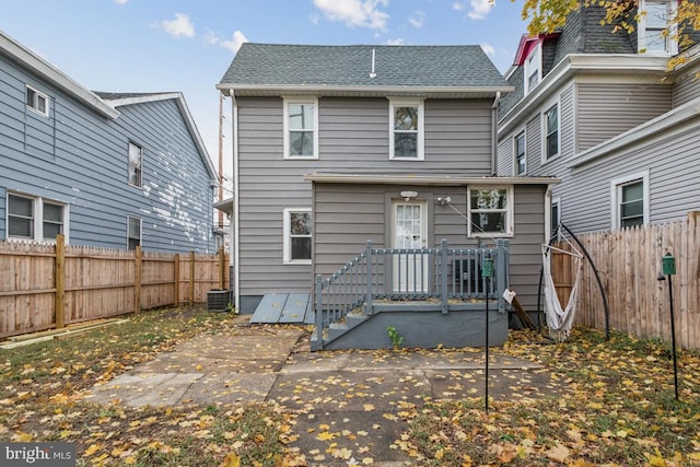 back of house with a patio