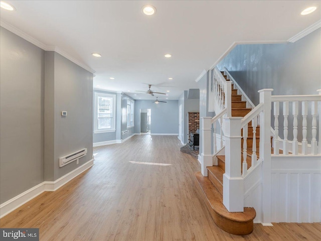 living room with ceiling fan, light hardwood / wood-style floors, and ornamental molding