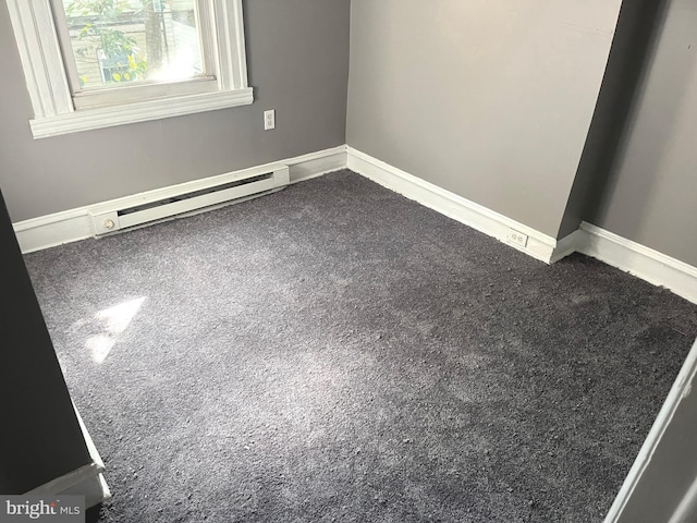 1635 S Etting St, Philadelphia, PA 19145 - empty room with a baseboard radiator, carpet flooring, and baseboards