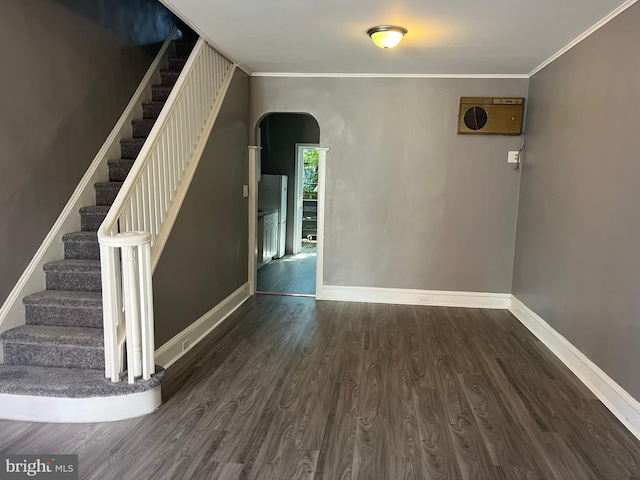 interior space with crown molding and dark hardwood / wood-style floors