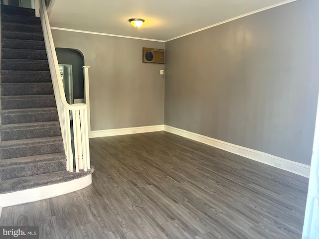 1635 S Etting St, Philadelphia, PA 19145 - empty room with wood finished floors, stairs, ornamental molding, baseboards, and arched walkways