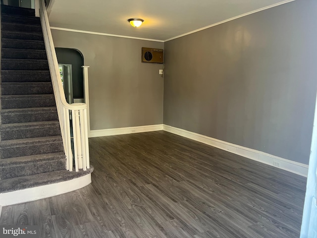 interior space featuring dark hardwood / wood-style floors and ornamental molding