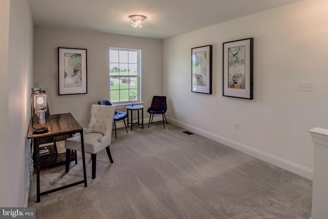 office space with light colored carpet