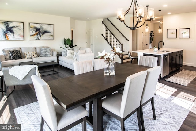 dining space featuring sink and dark wood-type flooring