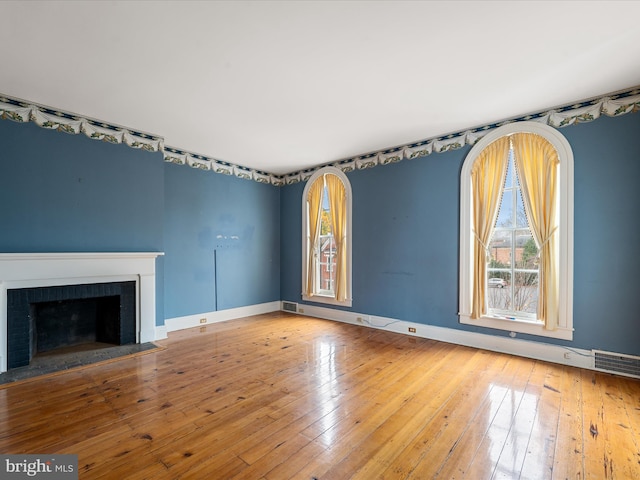 unfurnished living room with hardwood / wood-style flooring