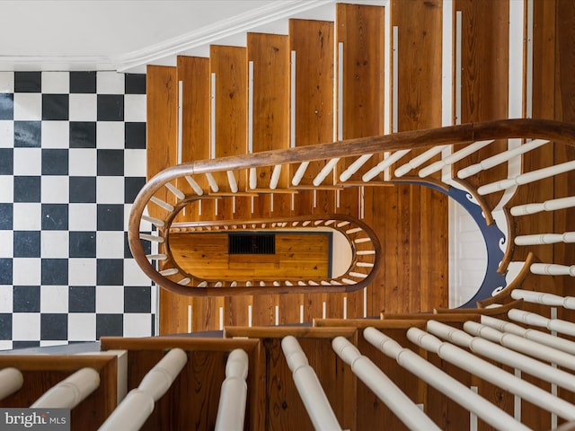 stairs featuring crown molding