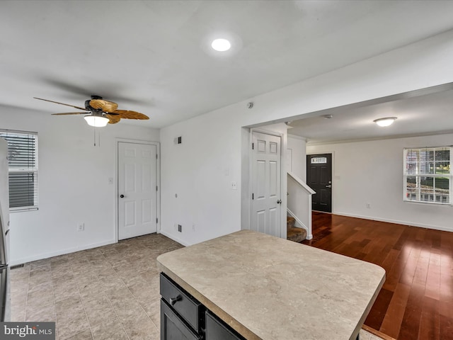 kitchen featuring ceiling fan and light hardwood / wood-style floors