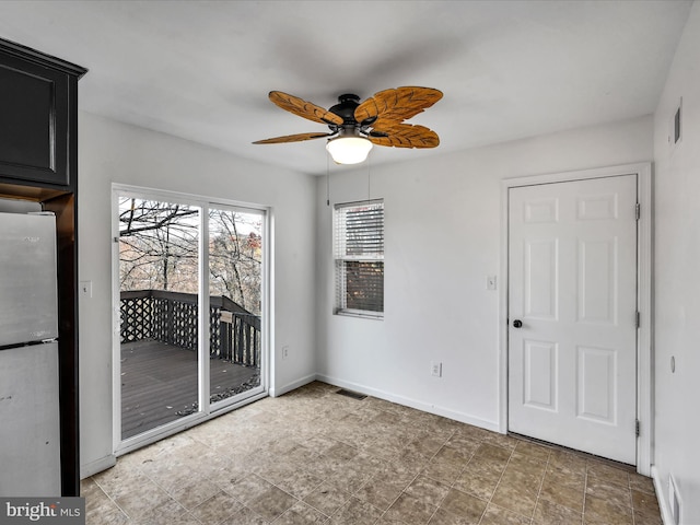 unfurnished room featuring ceiling fan