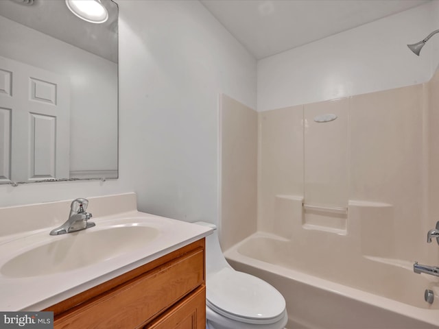 full bathroom featuring vanity, toilet, and tub / shower combination