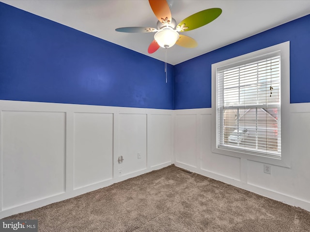 unfurnished room featuring light colored carpet and ceiling fan