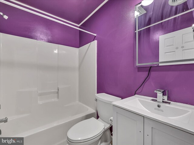 full bathroom featuring vanity, shower / bathtub combination, and toilet